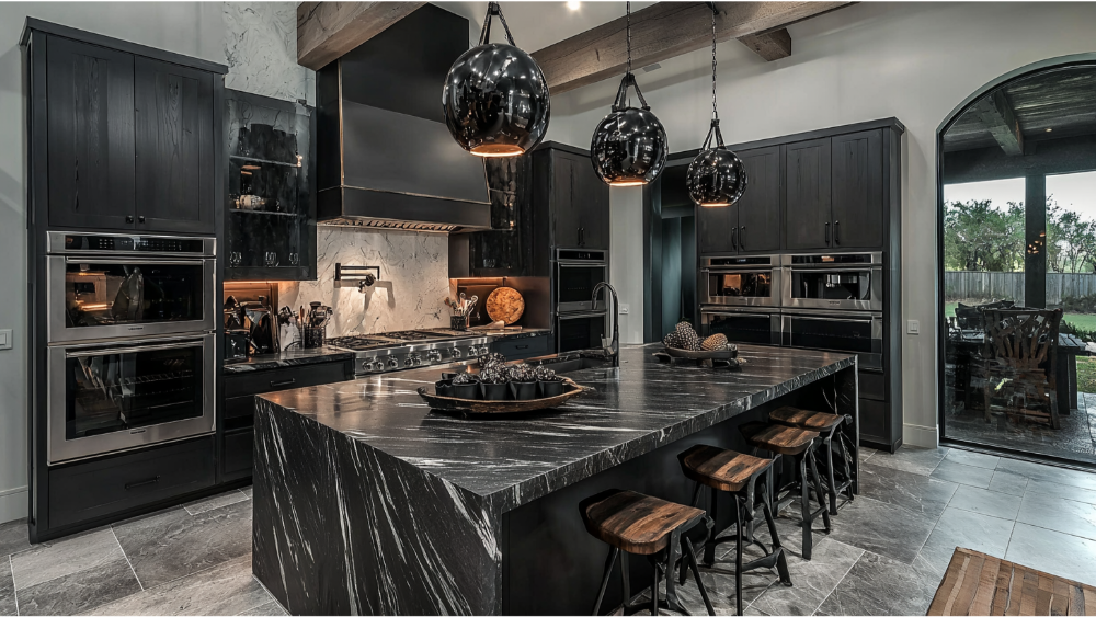 Contemporary black kitchen with a dramatic waterfall-style stone island countertop and modern pendant lighting.