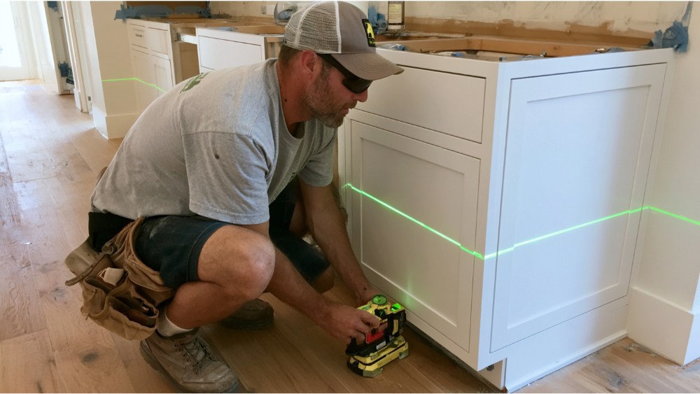 How Do Installers Level Cabinets On Uneven Floors